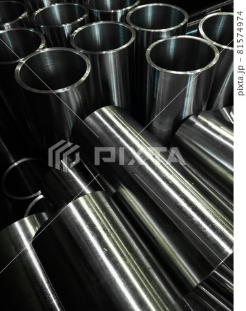 dark industrial background with cnc machined shiny steel pipes - selective focus and lens blur tech dark industrial background with cnc machined shiny steel pipes - selective focus and lens blur tech 81574974