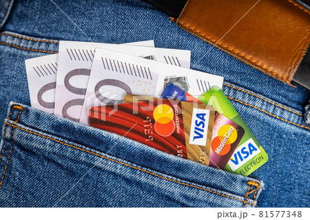 debit and credit cards of international payment systems visa and master cards with euro banknotes 81577348