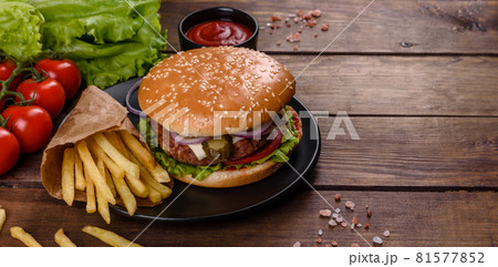 Craft beef burger and french fries on a black background 81577852