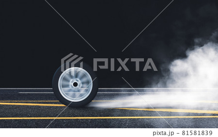 Car wheel burn rubber with spin circle motion on the asphalt road and white smoke at night 81581839