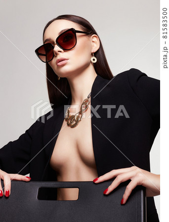 fashion portrait of Beautiful sexy woman in sunglasses and jewelry fashion portrait of Beautiful sexy woman in sunglasses and jewelry 81583500
