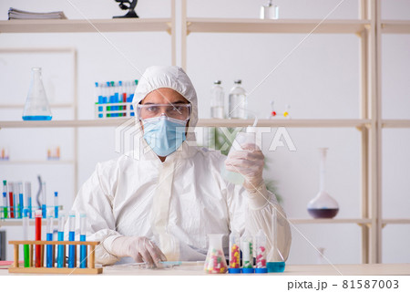 Young male chemist working at the lab during pandemic Young male chemist working at the lab during pandemic 81587003