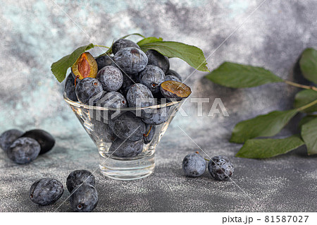 Plums on a light background. Harvesting the autumn harvest. Making jam and sauce. Still life. Plums on a light background. Harvesting the autumn harvest. Making jam and sauce. Still life. 81587027