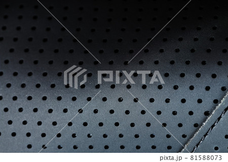 Close-up full-screen black textured leather with perforations 81588073