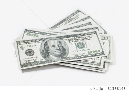 Pile of US dollar bills isolated on white background. US banknotes Pile of US dollar bills isolated on white background. US banknotes 81588143