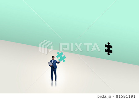 Businessman putting missing jigsaw puzzle piece 81591191