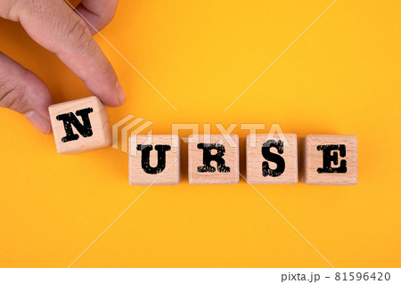 NURSE. Wooden cubes with text on a yellow background 81596420