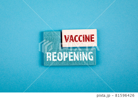 Reopening and Vaccine. Health and business concept. Wooden cubes with text on a blue background Reopening and Vaccine. Health and business concept. Wooden cubes with text on a blue background 81596426