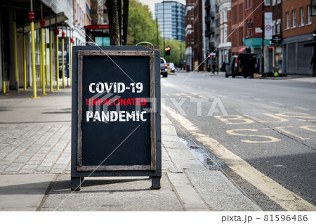 Covid-19 Unvaccinated Pandemic. Foldable advertising poster on the street 81596486