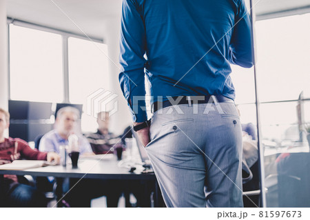 Business man making a presentation on corporate meeting. Business man making a presentation on corporate meeting. 81597673