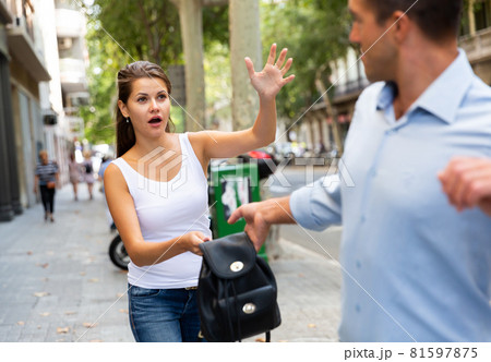 Thief stealing woman bag Thief stealing woman bag 81597875