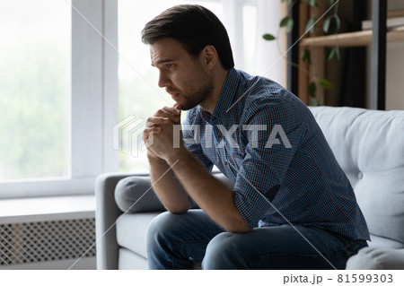 Frustrated desperate young man coping with loss, grief Frustrated desperate young man coping with loss, grief 81599303