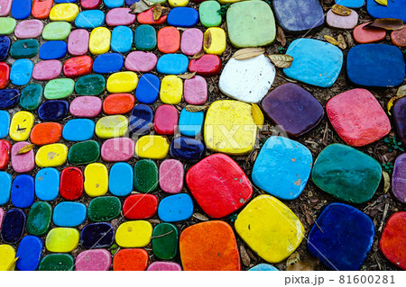 Top view on pieces of multicolored ceramic tiles decorated in garden. Old pavement of tiles textured. Street mosaic cobblestone sidewalk. Abstract,background and pattern of ceramic tile on the floor. 81600281