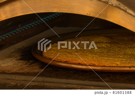 Farinata or Cecina made with chickpea flour in gas oven 81601388