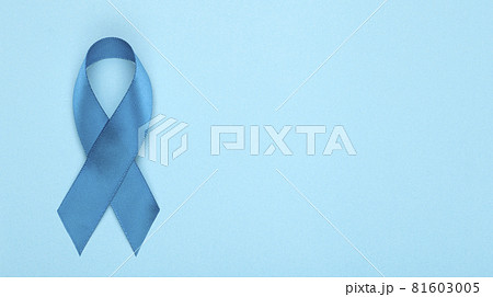 Blue ribbon on background. Prostate cancer awareness month. Blue ribbon symbol of world prostate cancer month and concept of healhcare. Copy space 81603005
