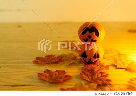 Halloween pumpkins with painted faces on a wooden table. Halloween background. Space for text. copy space. Halloween concept Halloween pumpkins with painted faces on a wooden table. Halloween background. Space for text. copy space. Halloween concept 81605764