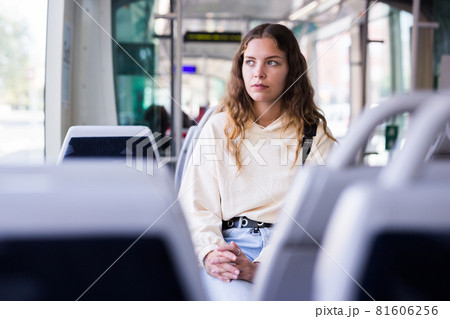 Portrait of a focused girl riding on public transport Portrait of a focused girl riding on public transport 81606256