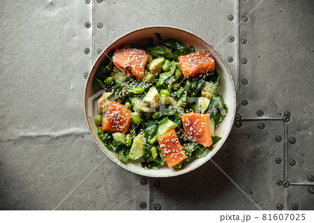 Healthy salmon bowl with avocado and edamame beans 81607025