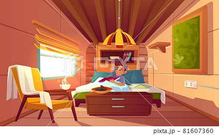 Man lying in bed in camper at morning 81607360
