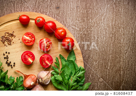 Fresh organic ingredients for salad making: spinach, tomatoes, sprouts, basil, olive oil on rustic background, top view. Fresh organic ingredients for salad making: spinach, tomatoes, sprouts, basil, olive oil on rustic background, top view. 81608437