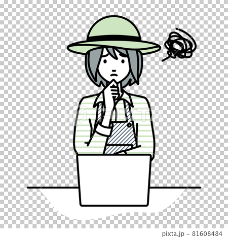 A farmer woman sitting at a desk and opening her PC 81608484