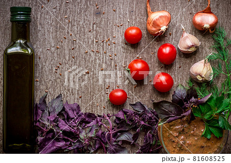 Fresh organic ingredients for sauce making: spinach, tomatoes, sprouts, basil, olive oil on rustic background, top view. Fresh organic ingredients for sauce making: spinach, tomatoes, sprouts, basil, olive oil on rustic background, top view. 81608525