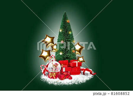 Christmas tree on white snow. Gift boxes, candy canes, balloons in form of golden stars, snow globe are nearby. Green background. Collage. Close-up. Christmas tree on white snow. Gift boxes, candy canes, balloons in form of golden stars, snow globe are nearby. Green background. Collage. Close-up. 81608852