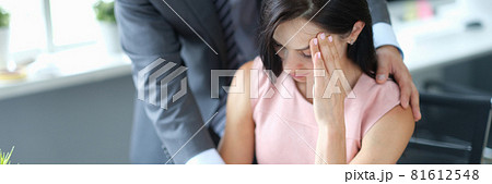 Businessman calming down young fatigue colleague at workplace Businessman calming down young fatigue colleague at workplace 81612548