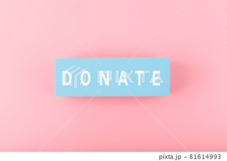 Donate modern minimal concept. Single word donate on bright pink background 81614993