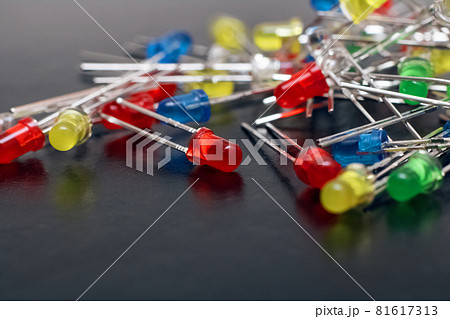 Bunch of multi-colored LEDs on gray background Bunch of multi-colored LEDs on gray background 81617313