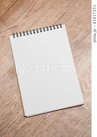 Notebook on a wooden table close up Notebook on a wooden table close up 81617351