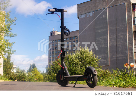 Electric scooter on the background of the city Electric scooter on the background of the city 81617661
