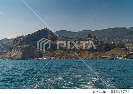 The Republic of Crimea. the city of Sudak. July 20, 2021. View of the ancient Genoese fortress from the Black Sea from the Sudak Bay. The Republic of Crimea. the city of Sudak. July 20, 2021. View of the ancient Genoese fortress from the Black Sea from the Sudak Bay. 81617774