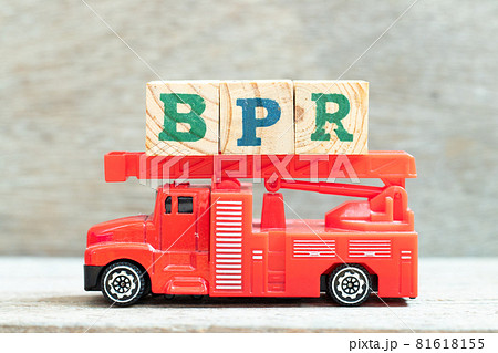 Fire ladder truck hold letter block in word BPR (Abbreviation of Business Process Reengineering or Batch processing record) on wood background 81618155