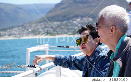 Asian senior elderly couple on tourist ferry boat to seals islan 81620169