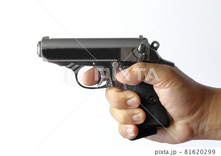 The compact Semi automatic pistol, stainless steel PPKs pistol with spare magazines right side view, Ready for use, lying isolated on white background. The compact Semi automatic pistol, stainless steel PPKs pistol with spare magazines right side view, Ready for use, lying isolated on white background. 81620299