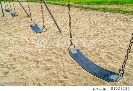 empty swings in playground empty swings in playground 81625189