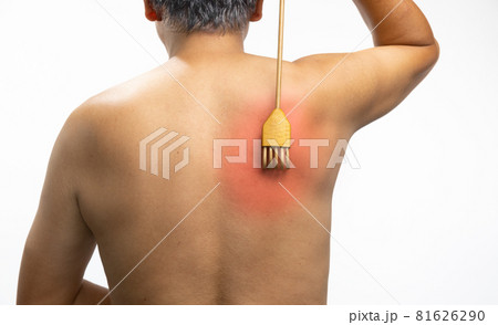 Senior man scratching his back with a back scratcher. Senior man scratching his back with a back scratcher. 81626290