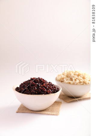 Organic boiled brown rice on bowl isolated in white background Organic boiled brown rice on bowl isolated in white background 81638109