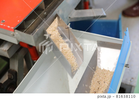 Factory machine Milling rice in close up Factory machine Milling rice in close up 81638110