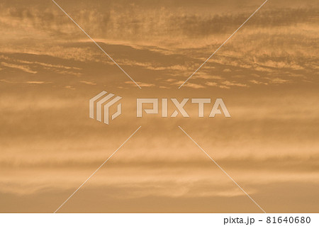 Abstract sky background of deep golden sunset clouds. Full frame 81640680