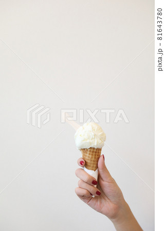 Woman hand with ice cream in close up 81643780