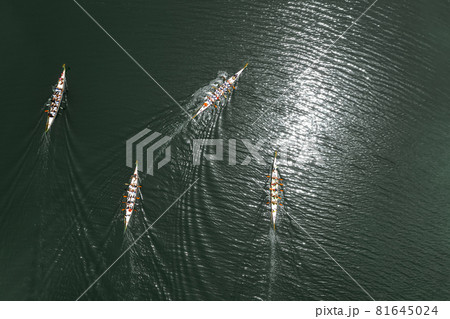Top view of four dragon boats racing 81645024