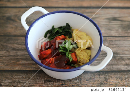 Shrimp dumpling with roasted pork on wood background Shrimp dumpling with roasted pork on wood background 81645134