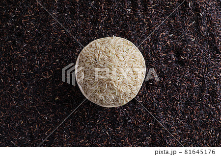 Organic raw brown rice and riceberry rice in close up 81645176