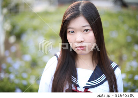 school girl costume at park outdoor with flowers garden background 81645280