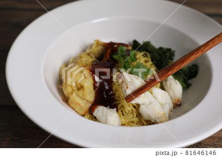 Shrimp dumpling noodles and crab meat on wood background Shrimp dumpling noodles and crab meat on wood background 81646146