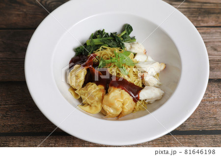 Shrimp dumpling noodles and crab meat on wood background Shrimp dumpling noodles and crab meat on wood background 81646198