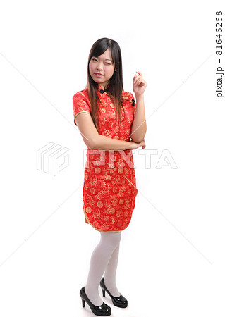 beauty woman wear red cheongsam looking and smile in chinese new year 81646258