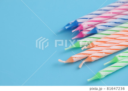 Colorful candles isolated in blue background 81647236